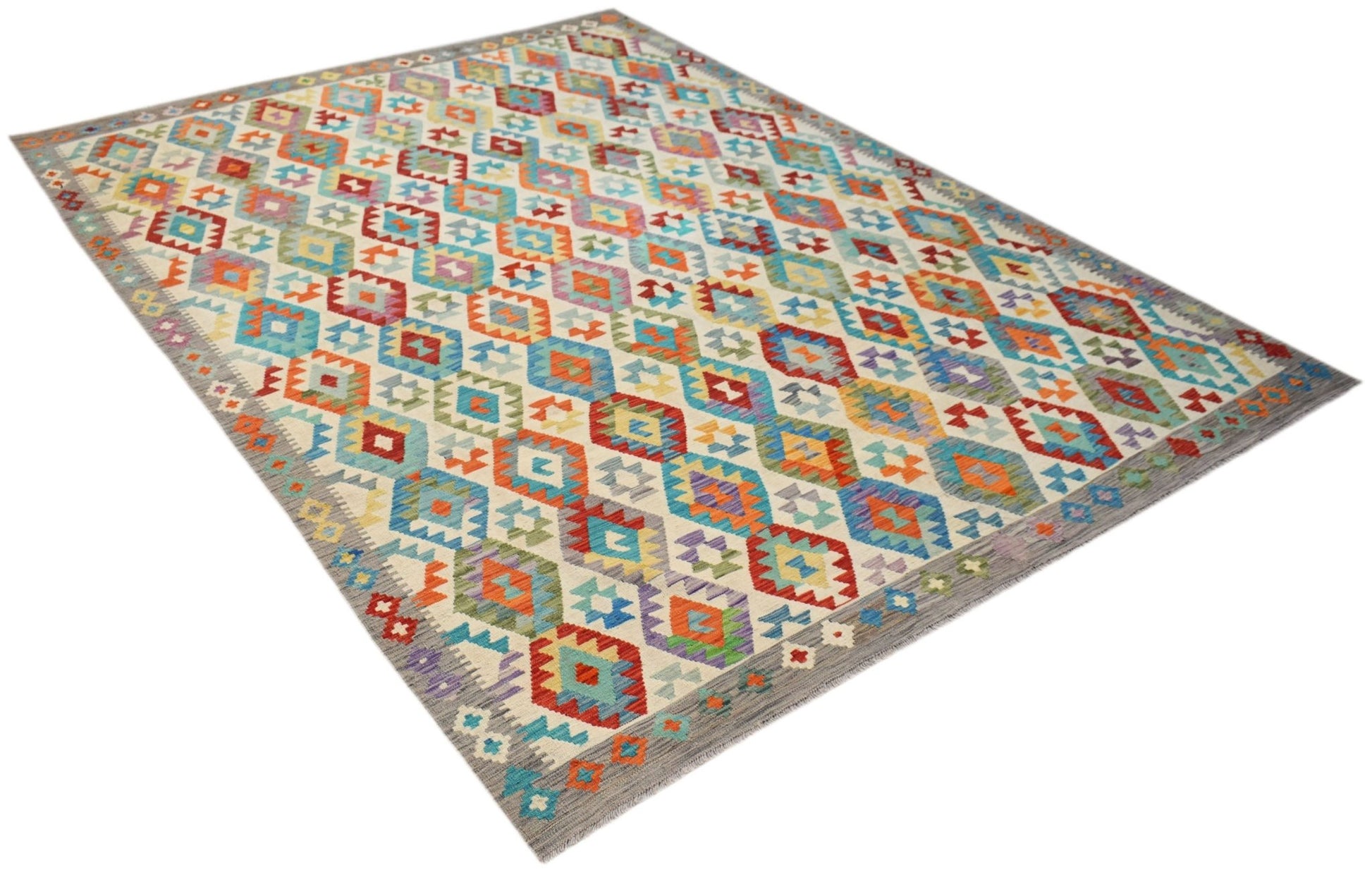 A handmade Afghan Maimana kilim rug featuring a colorful geometric diamond pattern.