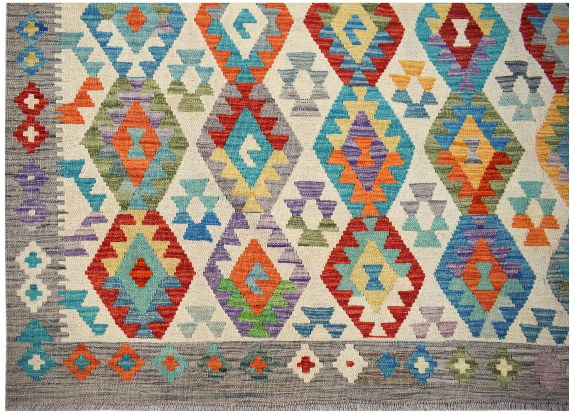 Handwoven Afghan Maimana kilim featuring a vibrant geometric diamond pattern in wool.