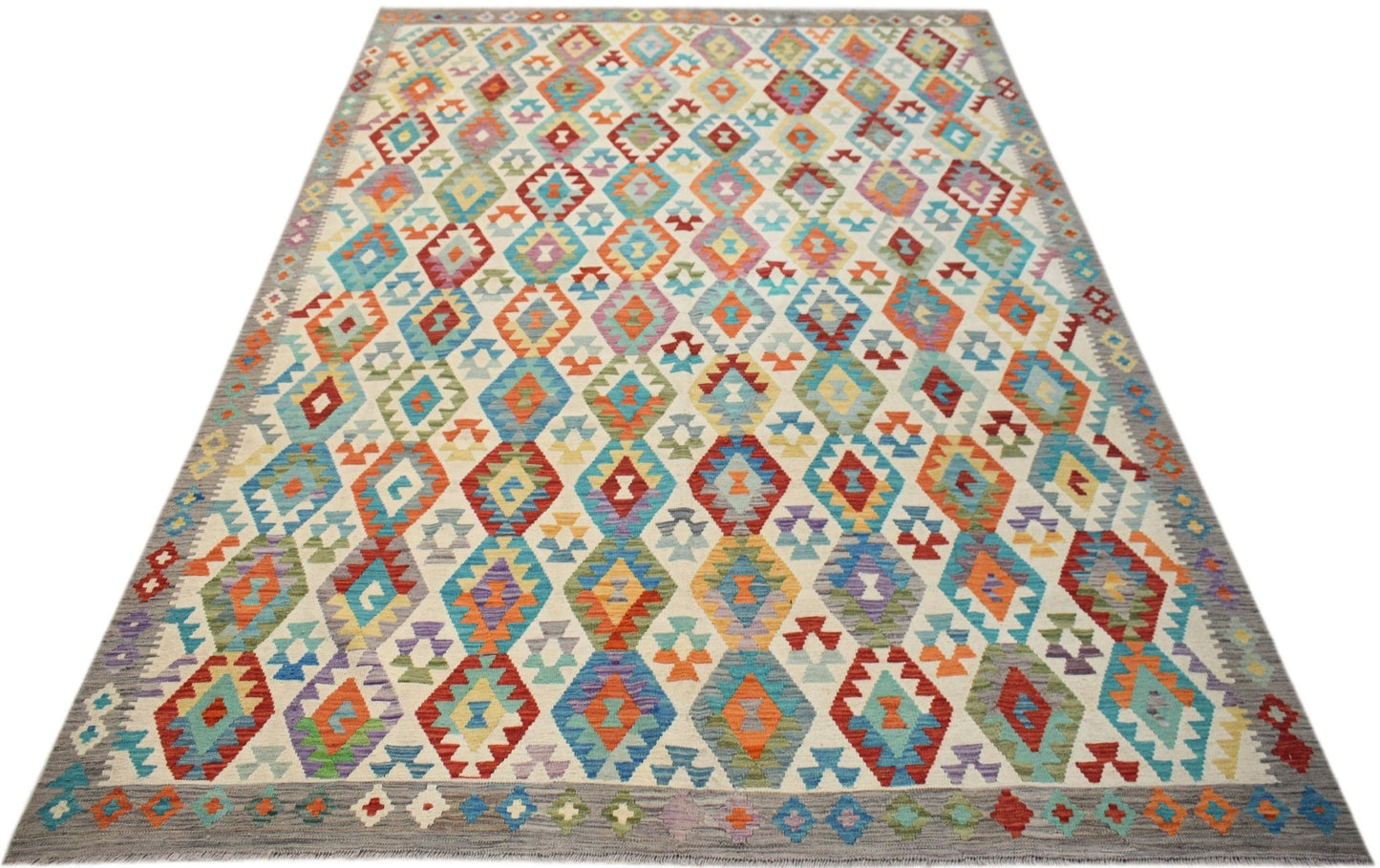 Handwoven Afghan Maimana Kilim rug featuring a colorful geometric diamond pattern on a wool base.