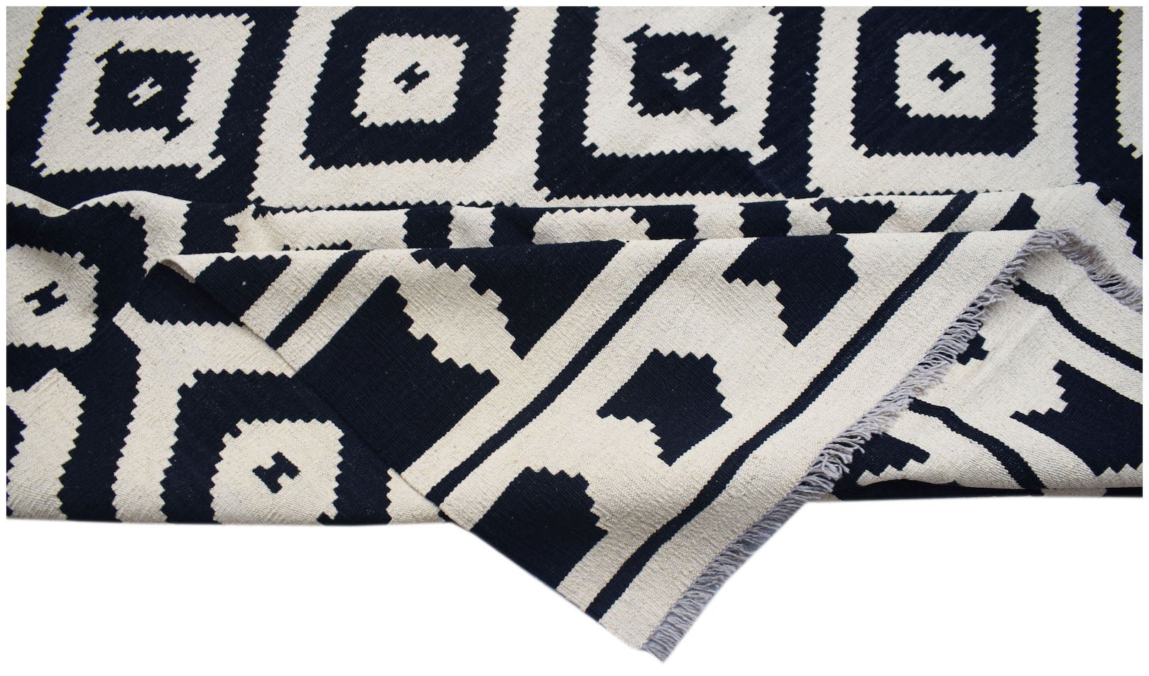 Handwoven Afghan Maimana kilim rug featuring a black and white geometric diamond pattern.