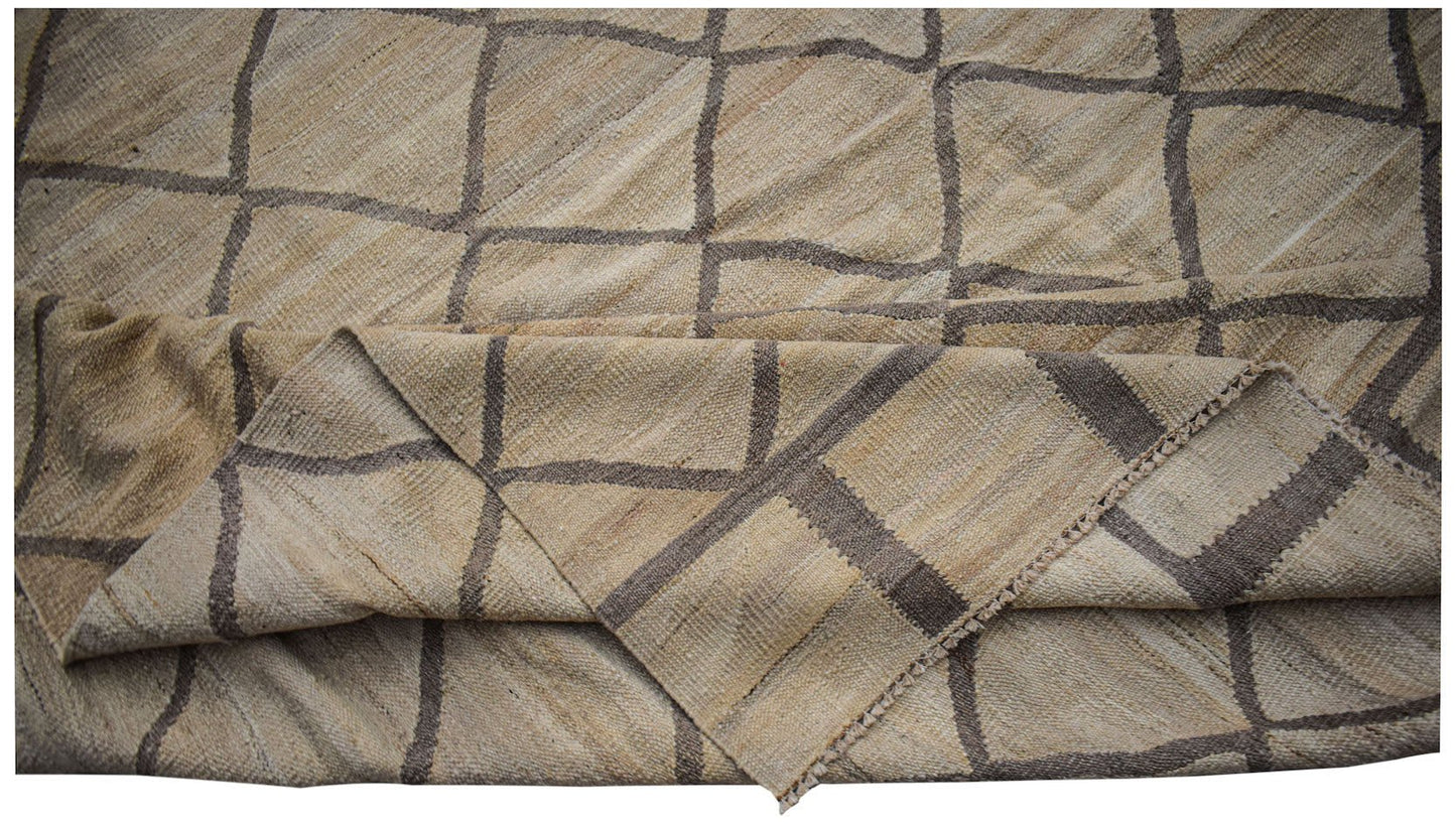 Afghan Maimana Kilim with a geometric grid pattern in natural and brown tones.