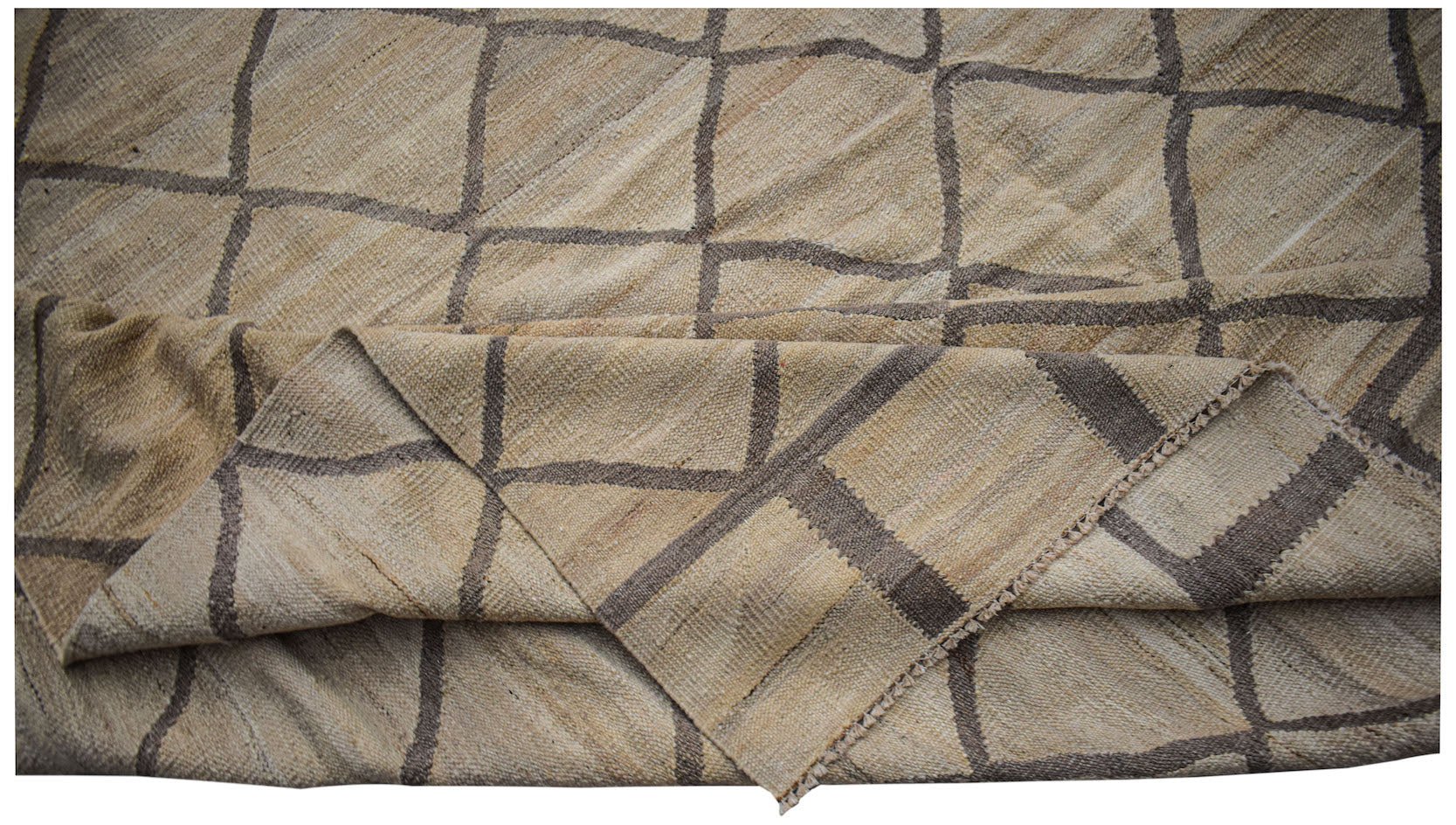 Afghan Maimana Kilim with a geometric grid pattern in natural and brown tones.