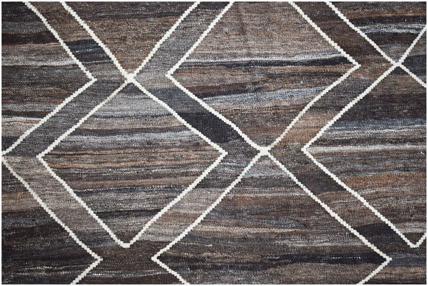 Handwoven Afghan Maimana kilim featuring a geometric diamond pattern in natural wool tones.
