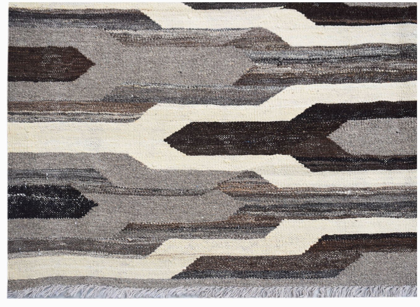 Afghan Maimana Kilim with geometric patterns in shades of brown, grey, and cream.