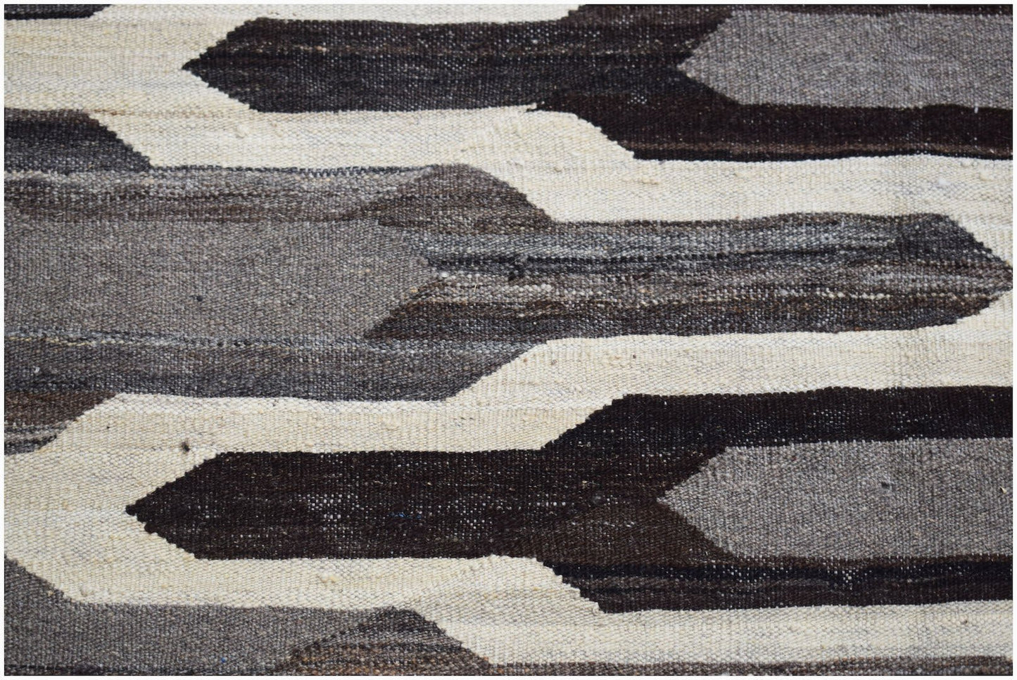 Afghan Maimana Kilim with geometric patterns in shades of brown and cream.
