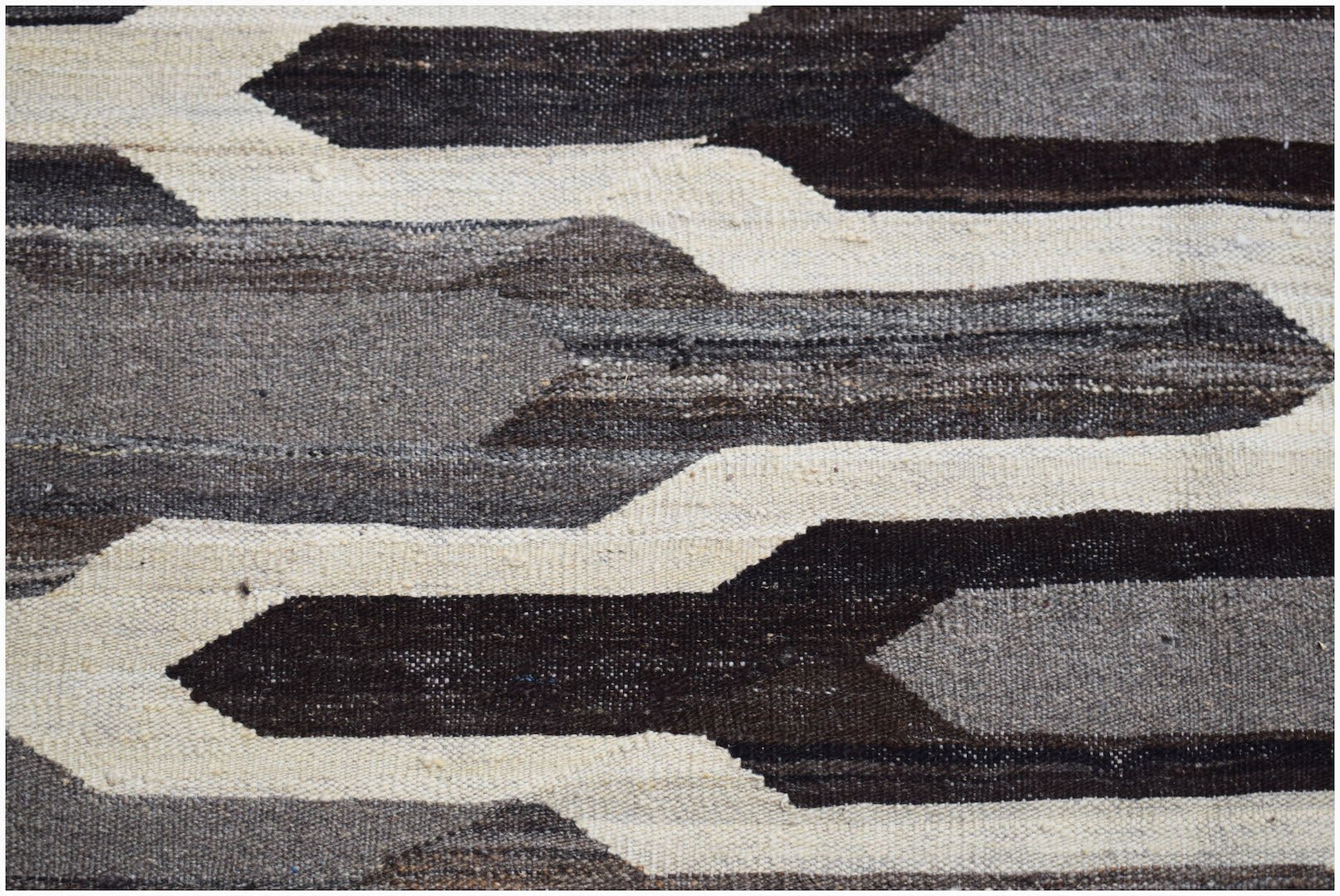 Afghan Maimana Kilim with geometric patterns in shades of brown and cream.