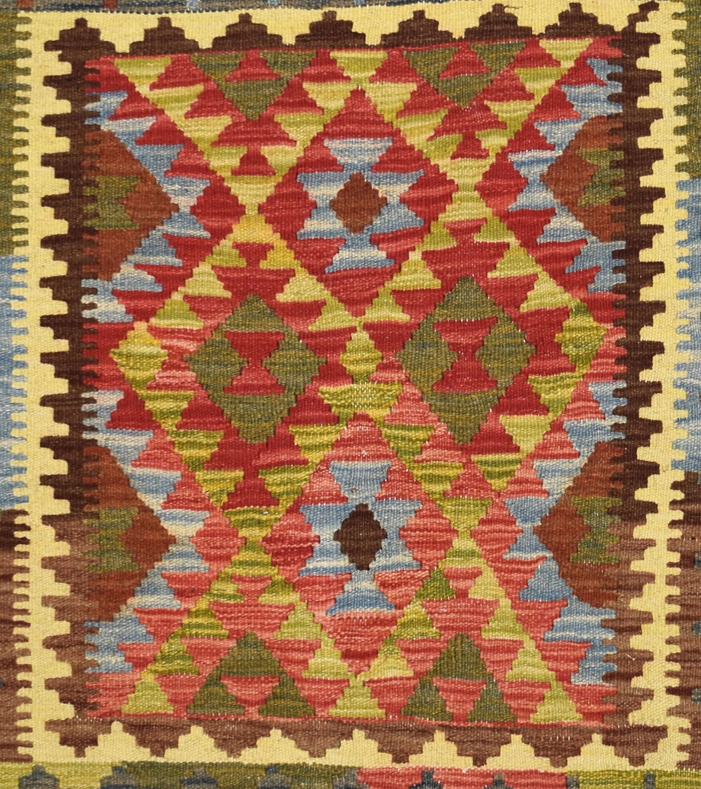 Handmade Afghan Maimana kilim rug featuring a vibrant geometric diamond pattern in wool.