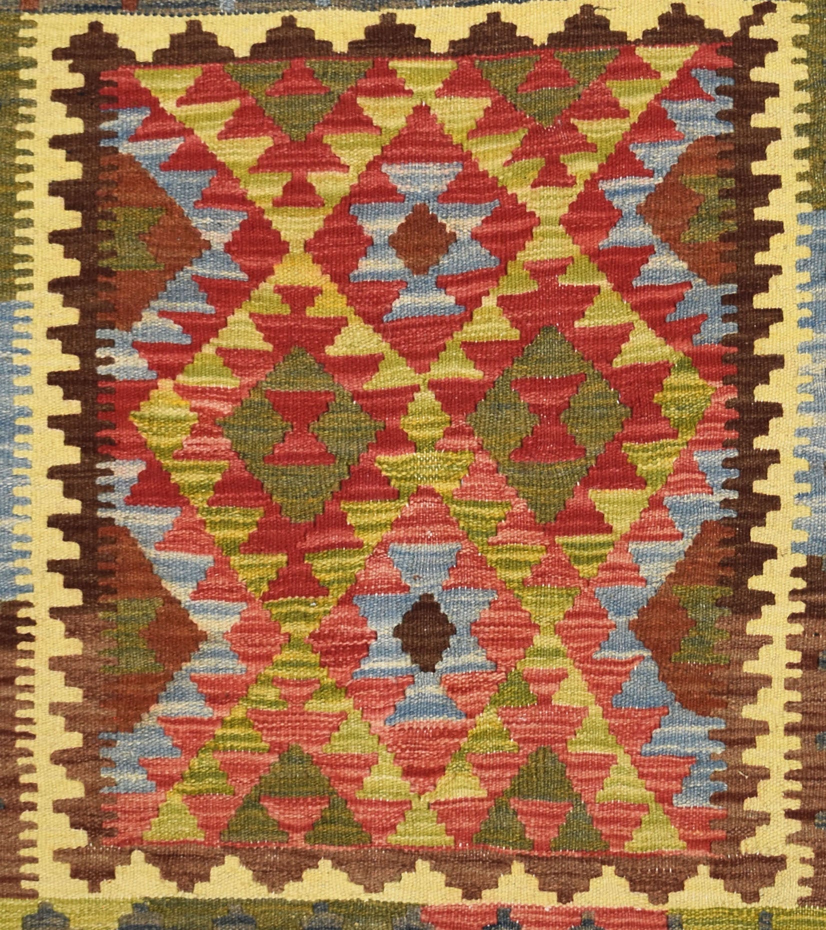 Handmade Afghan Maimana kilim rug featuring a vibrant geometric diamond pattern in wool.