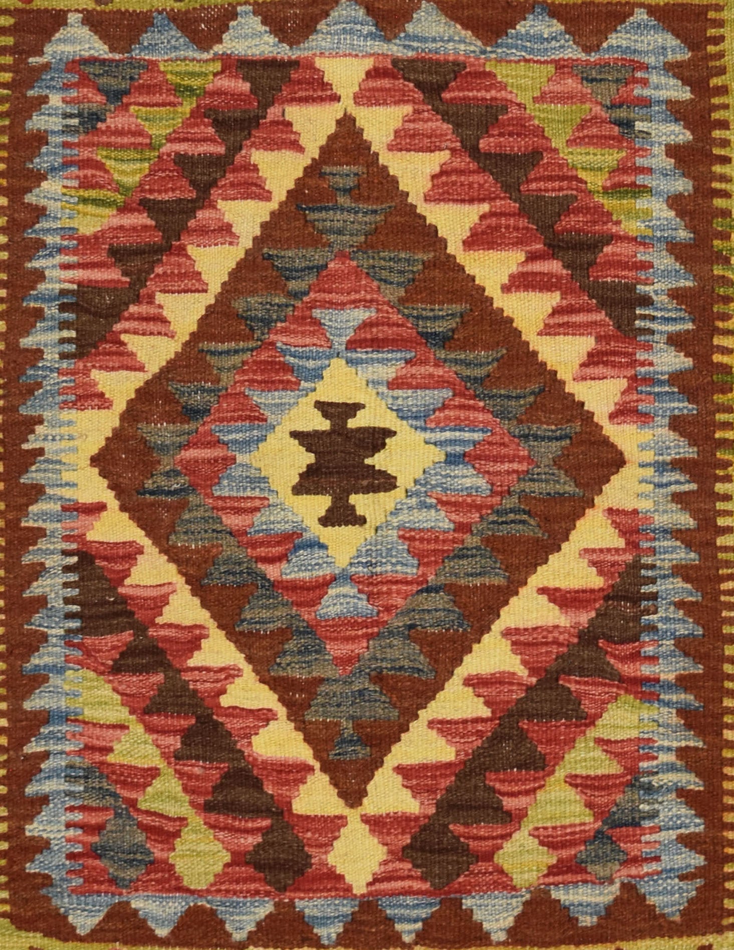Handmade Afghan Maimana kilim rug featuring a central diamond motif in earthy tones.