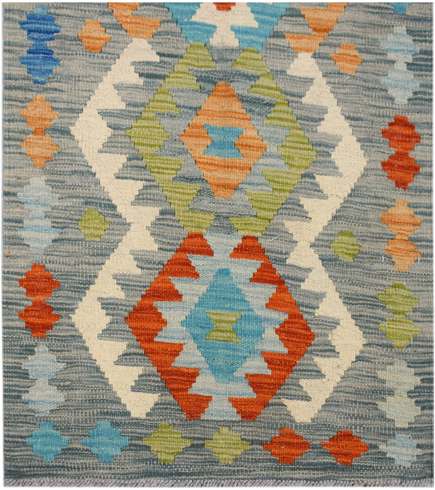 Handwoven Afghan Maimana kilim runner featuring a geometric pattern in blue, orange, and green.