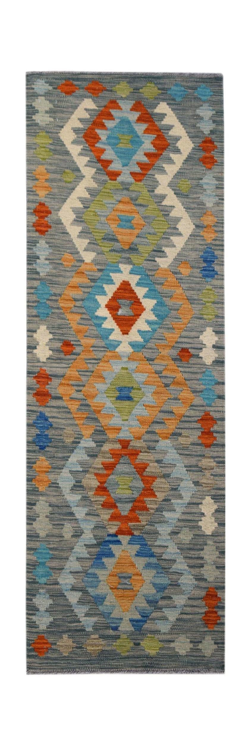 Handwoven Afghan Maimana wool runner featuring a geometric diamond pattern in vibrant colors.