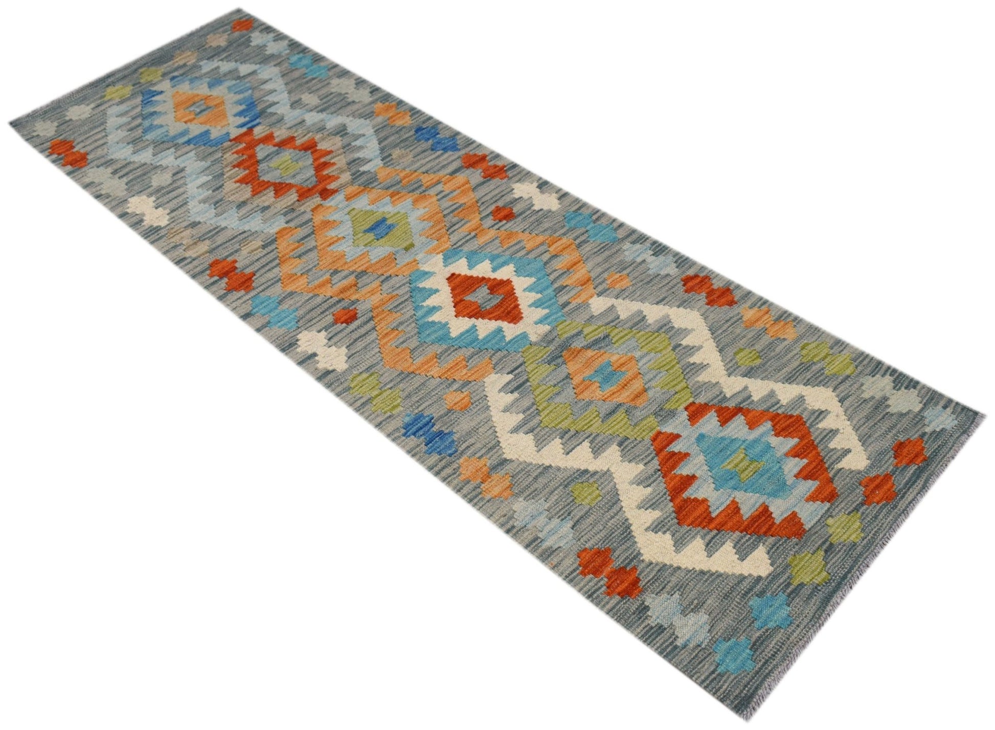 A handmade Afghan Maimana wool runner rug featuring a geometric pattern in blue, orange, and green.