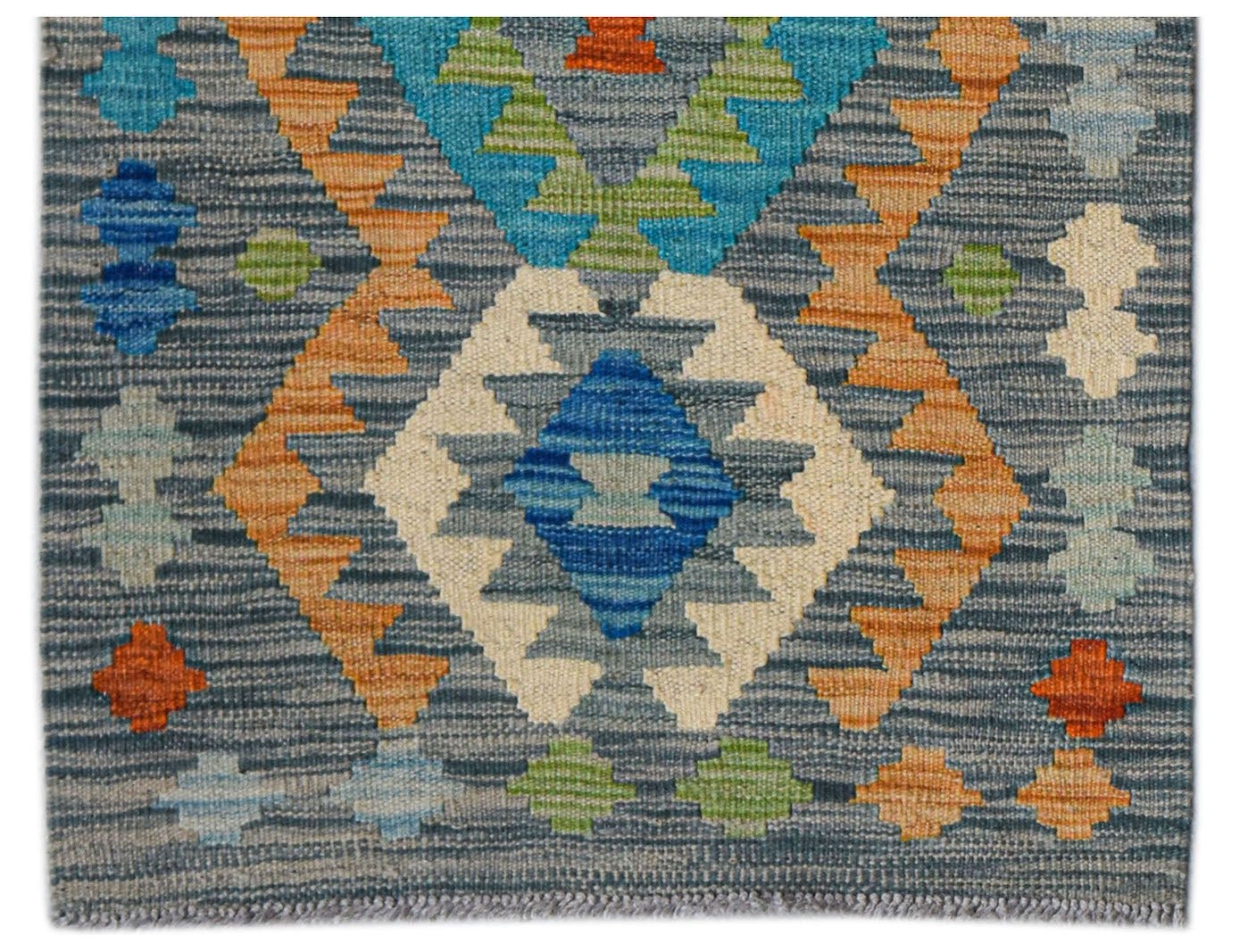 Handwoven Afghan Maimana wool runner featuring a geometric pattern in blue, orange, and green.