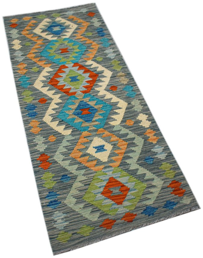 Handwoven Afghan Maimana wool runner rug featuring a colorful geometric diamond pattern.
