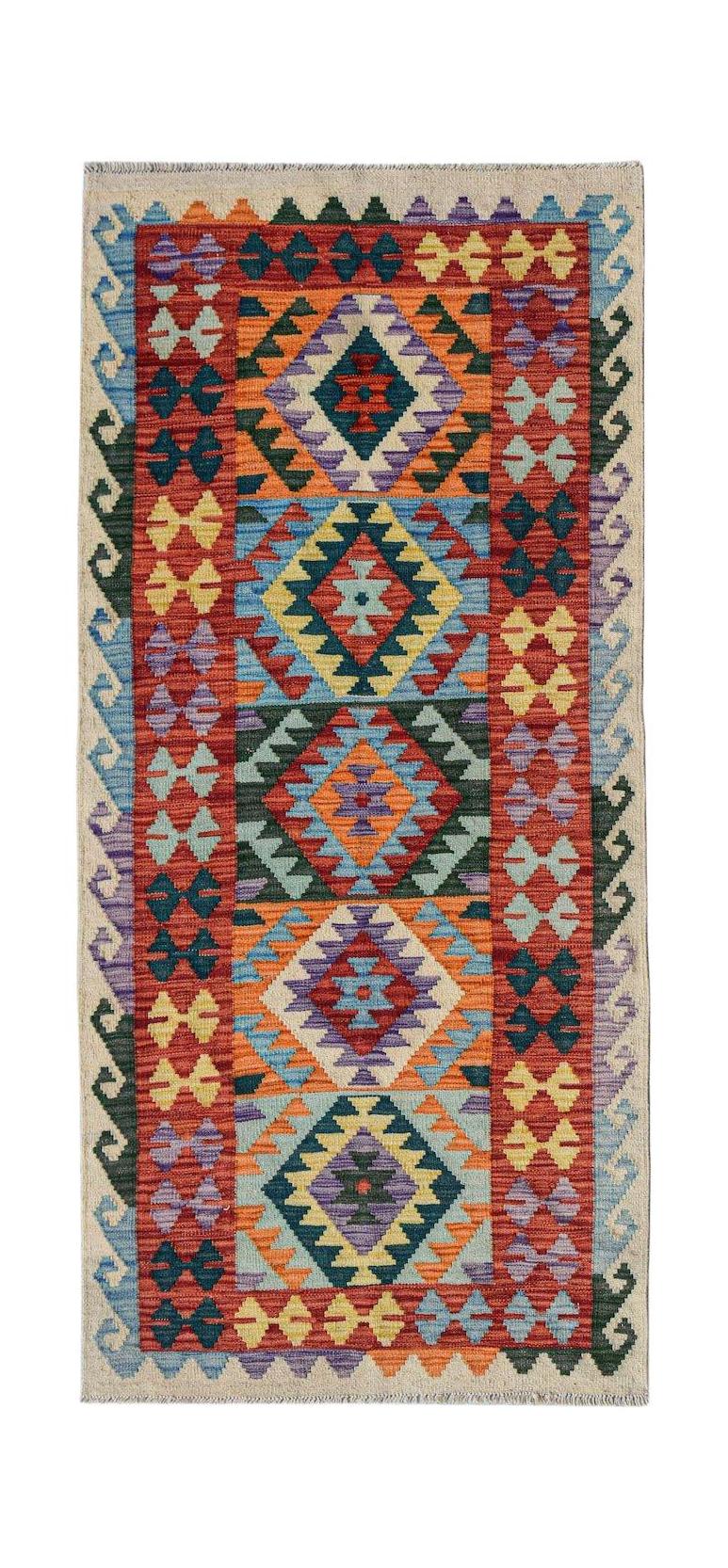 Handwoven Afghan Maimana wool runner featuring a colorful geometric diamond pattern.