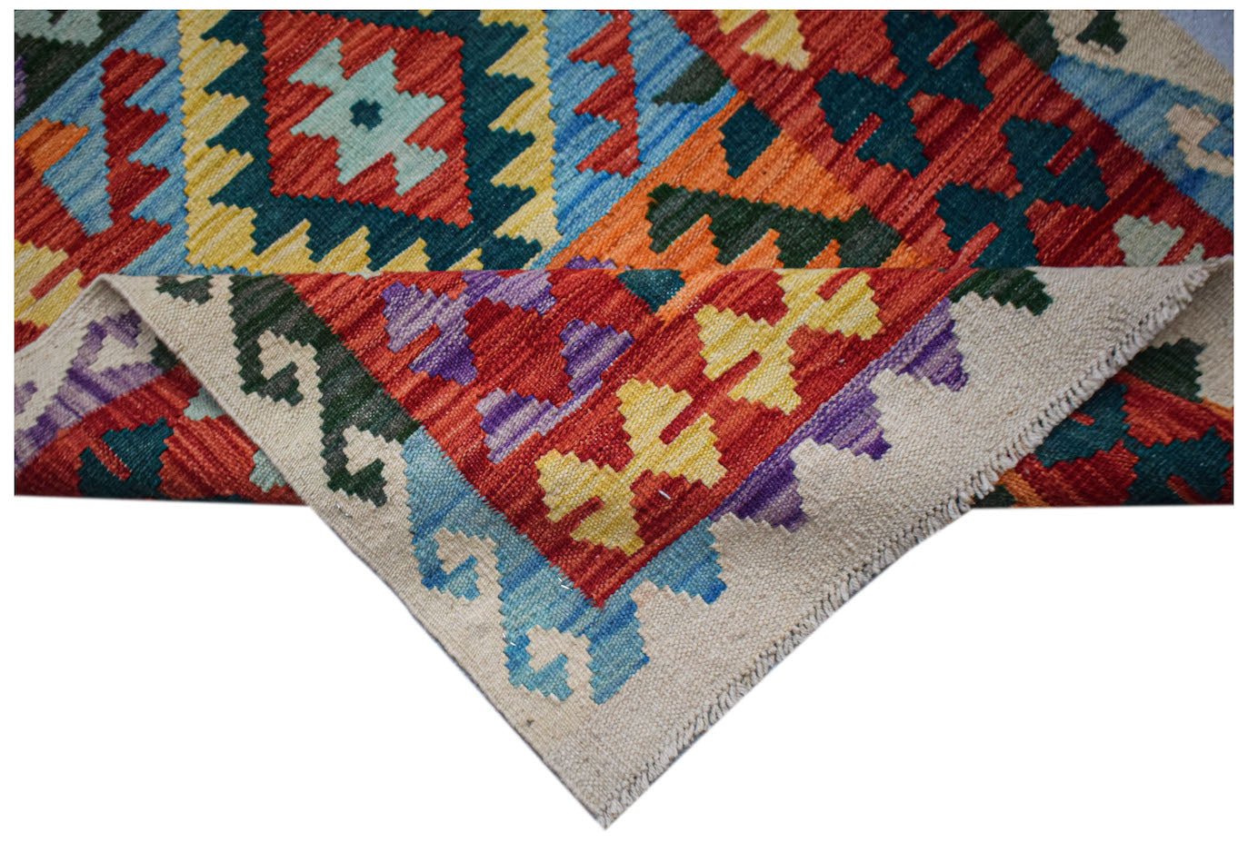 Handwoven Afghan Maimana wool kilim runner featuring a vibrant geometric pattern.