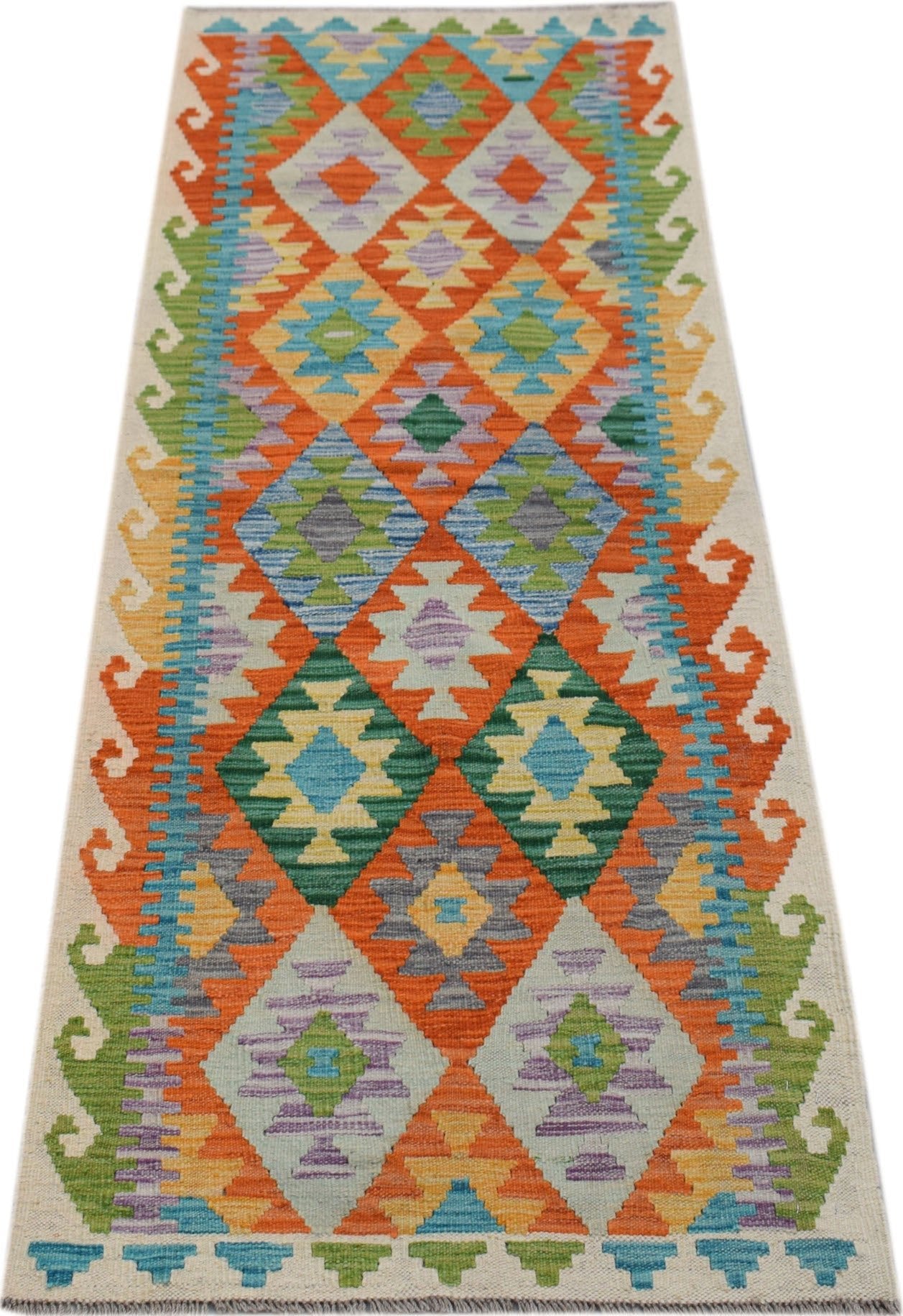 Handwoven Afghan Maimana wool runner rug featuring a colorful geometric diamond pattern.