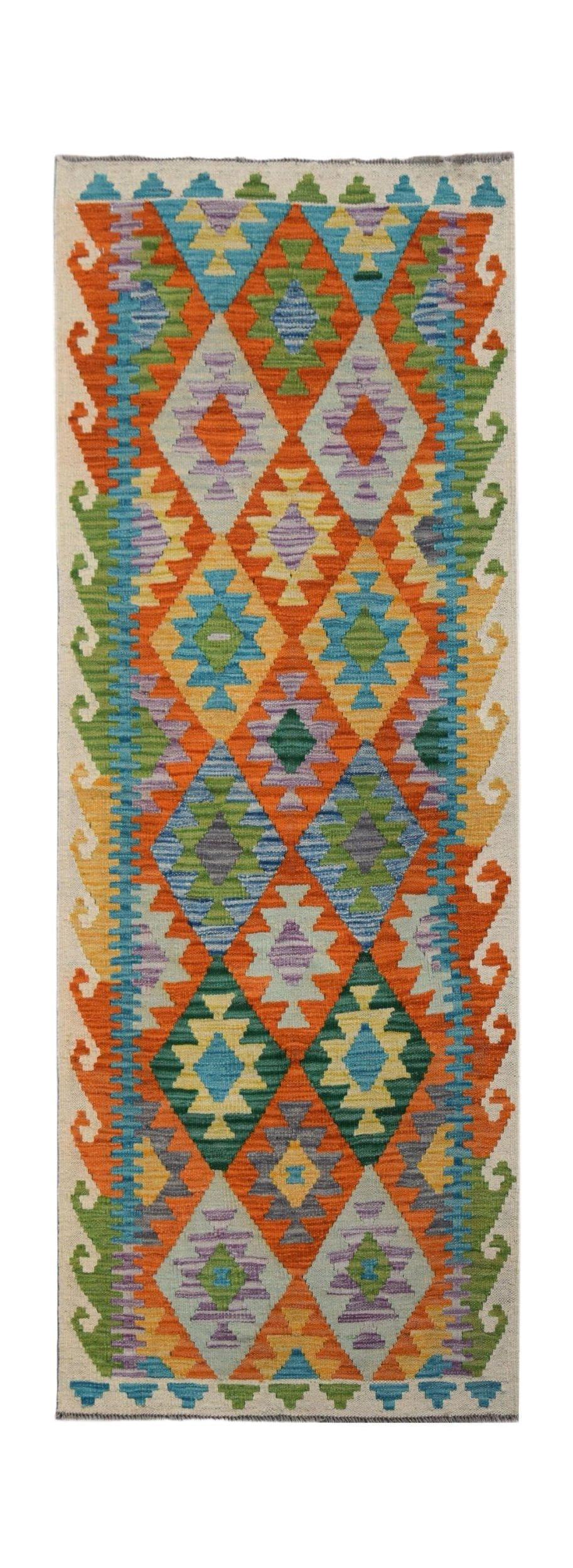 Handwoven Afghan Maimana wool runner rug featuring a colorful geometric diamond pattern.