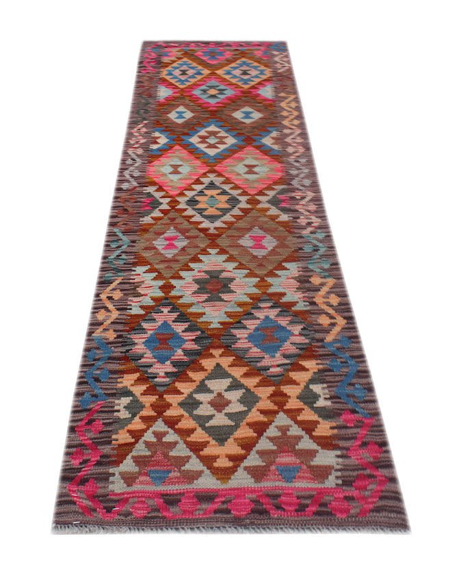Handwoven Afghan Maimana wool runner rug featuring a colorful geometric diamond pattern.