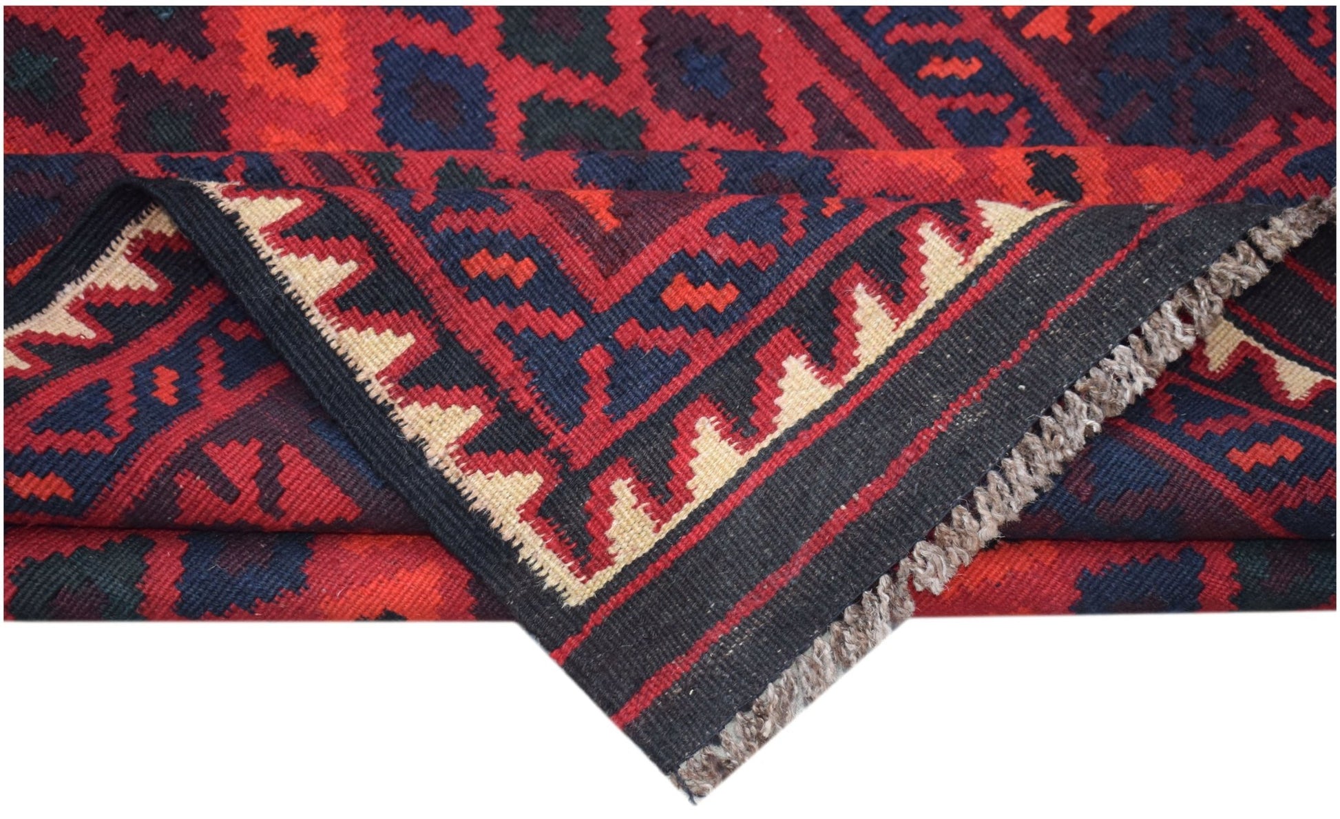 A handmade Afghan Maimana kilim runner featuring geometric patterns in red, black, and cream.
