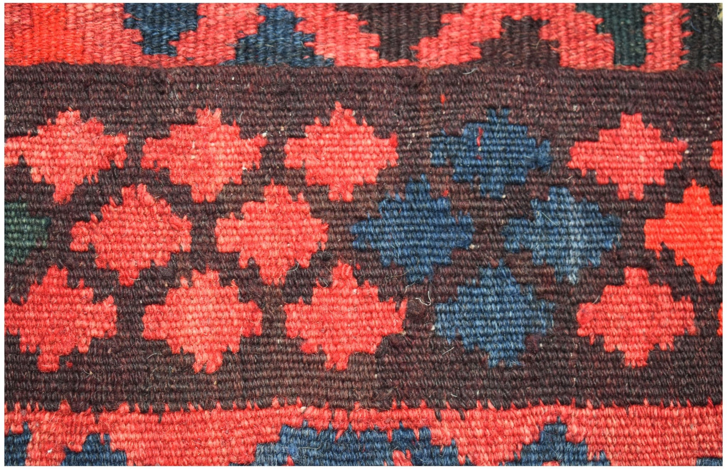 Handwoven Afghan Maimana kilim runner featuring a geometric pattern of red and blue diamonds.