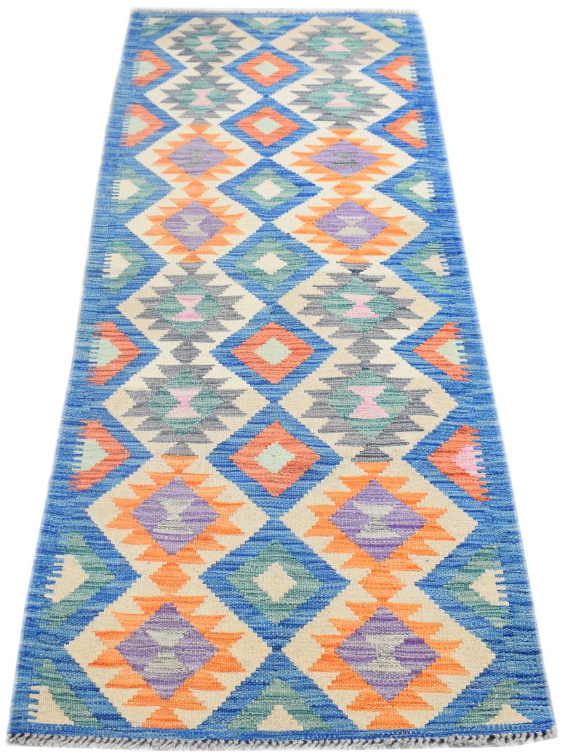 Handmade Afghan Maimana wool runner rug featuring a colorful geometric diamond pattern.