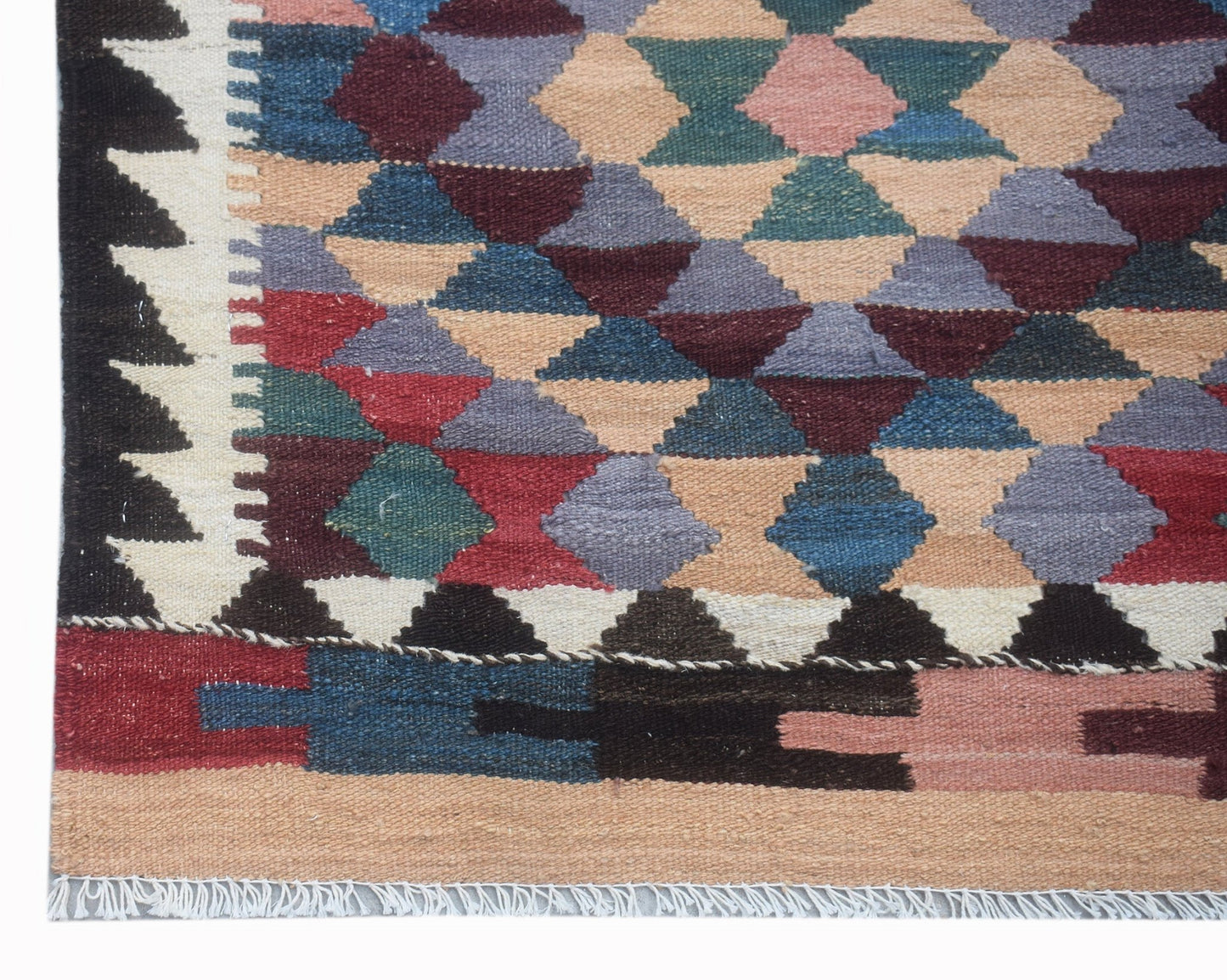 Handwoven Afghan Maimana wool runner featuring a geometric diamond pattern in multicolored tones.