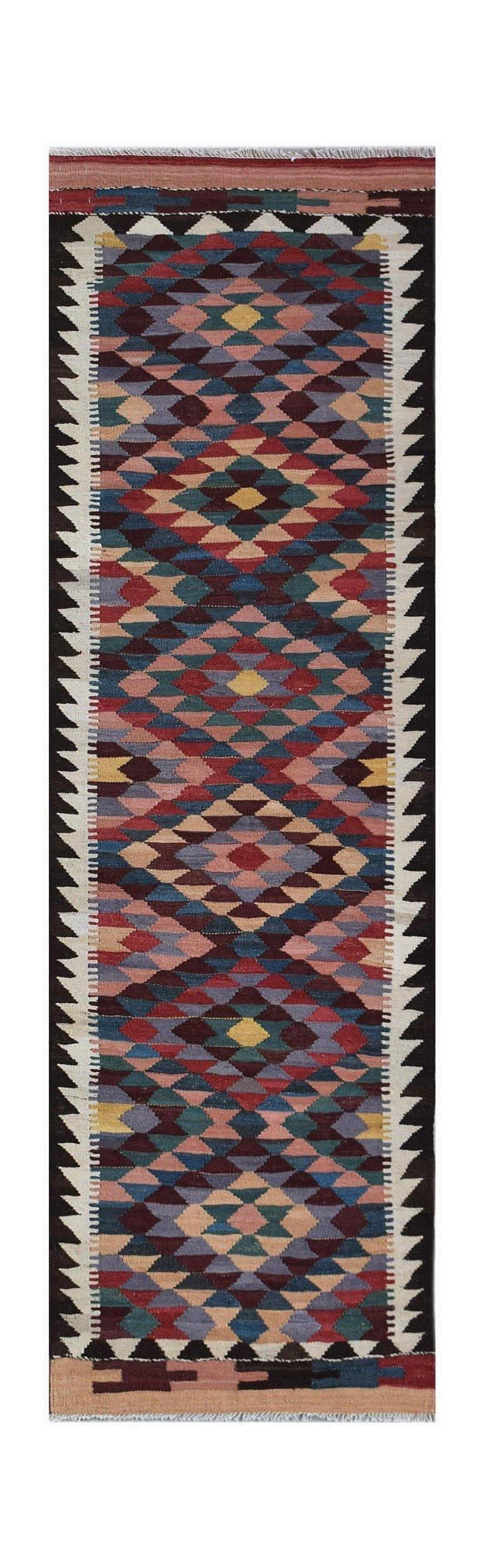 Handwoven Afghan Maimana wool runner featuring a colorful geometric diamond pattern.