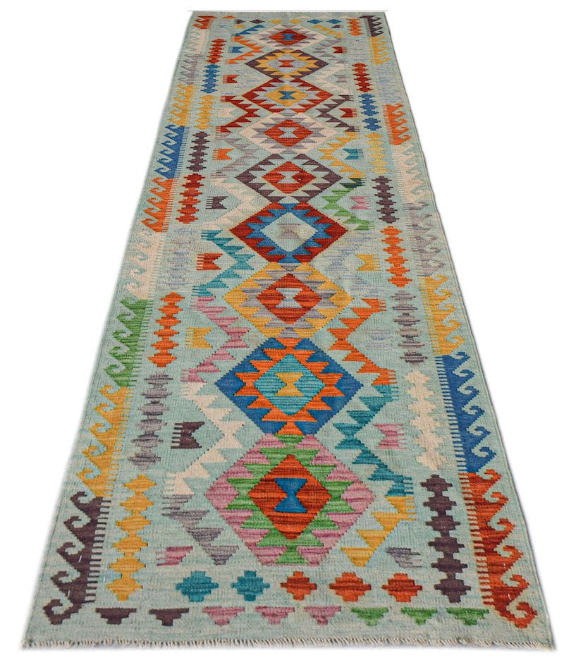 Afghan Maimana Kilim runner with geometric patterns in blue, orange, and green.
