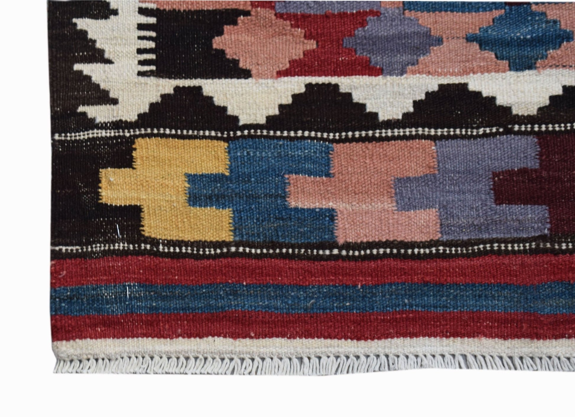 A handmade Afghan Maimana kilim runner featuring geometric patterns in vibrant wool colors.