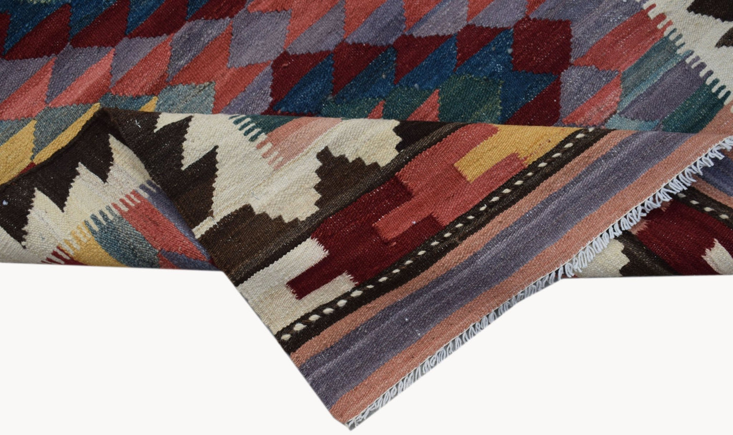 Handwoven Afghan Maimana wool kilim runner featuring a colorful geometric diamond pattern.