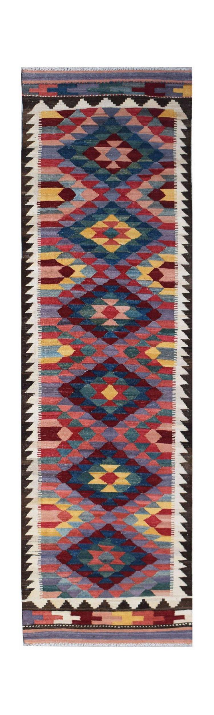Handwoven Afghan Maimana wool runner rug featuring a colorful geometric diamond pattern.