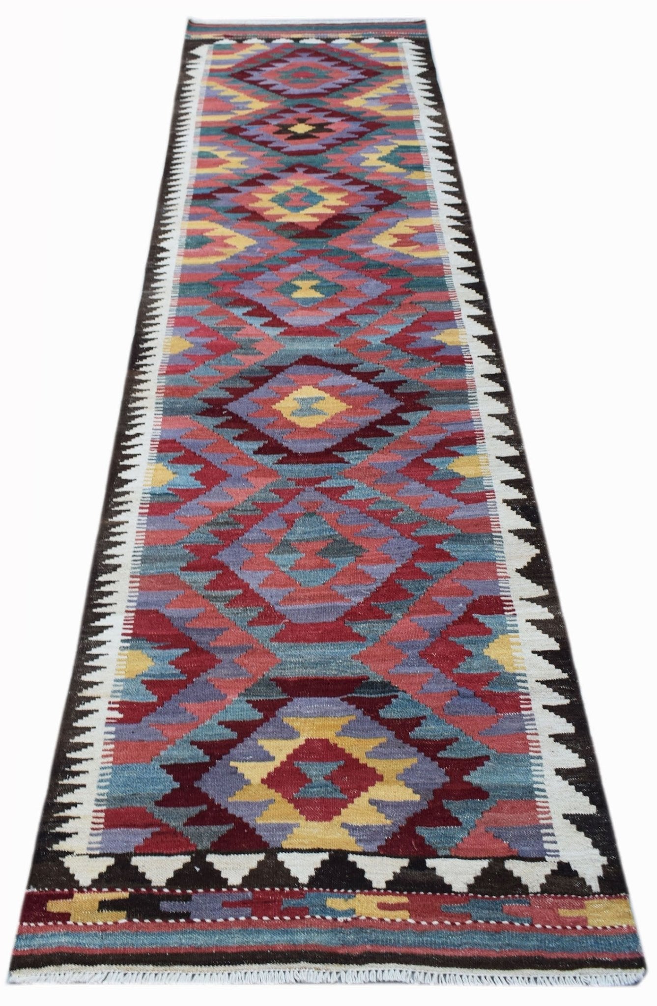 Handwoven Afghan Maimana wool runner rug featuring a colorful geometric diamond pattern.