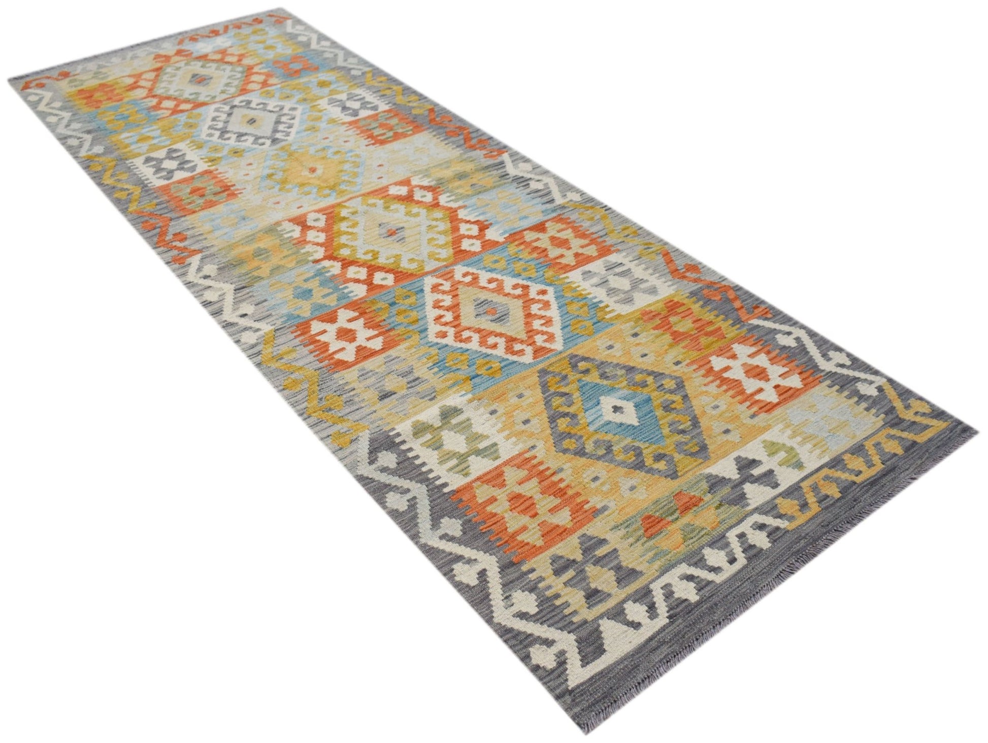 A handmade Afghan Maimana wool runner rug featuring a colorful geometric pattern.