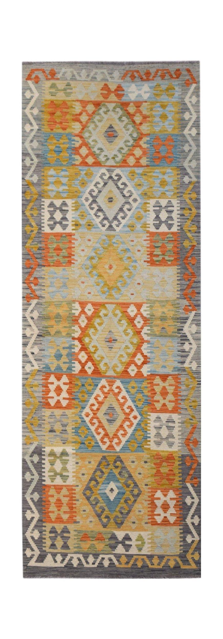 Handwoven Afghan Maimana wool runner rug featuring a colorful geometric pattern.
