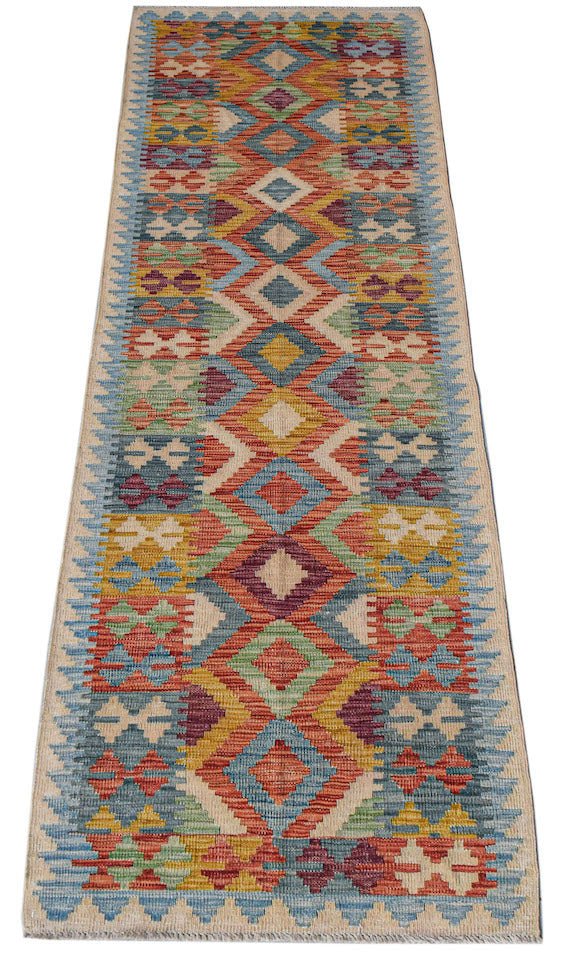 Afghan Maimana Kilim runner with geometric patterns in red, blue, yellow, and green.