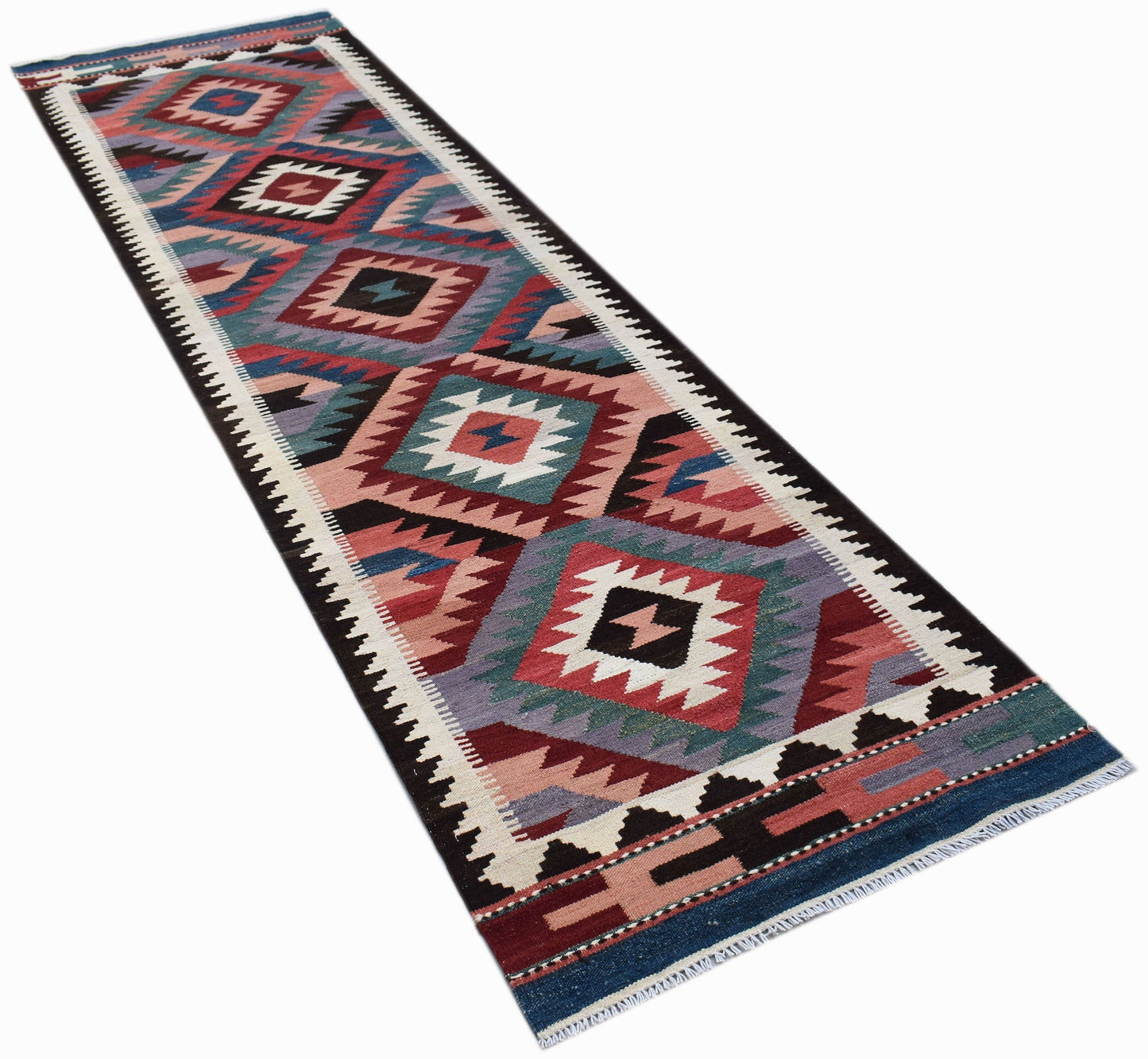 Handwoven Afghan Maimana wool runner featuring a geometric diamond pattern in vibrant colors.