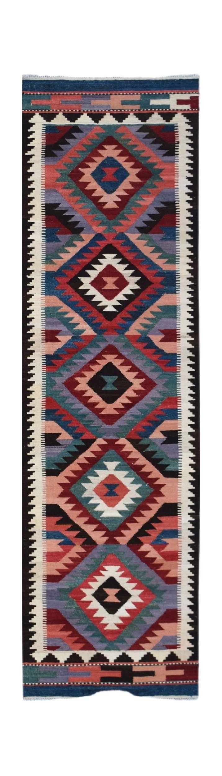 Handwoven Afghan Maimana wool runner rug featuring a colorful geometric diamond pattern.