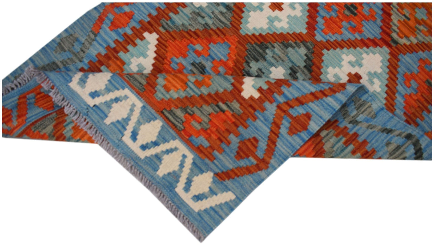 Handwoven Afghan Maimana kilim runner featuring a geometric pattern in blue, orange, and white.