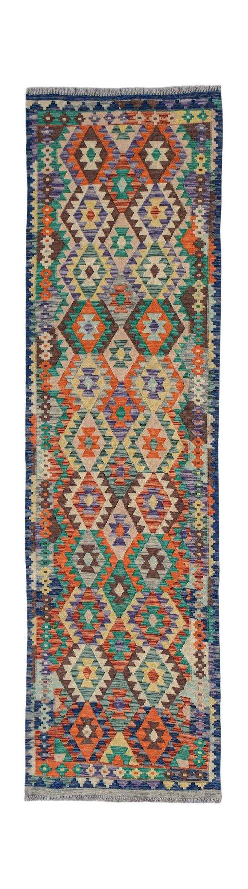 A handmade Afghan Maimana wool runner rug featuring a colorful geometric diamond pattern.