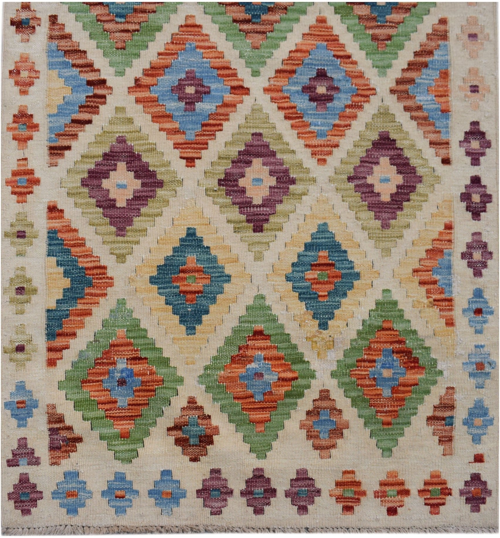 Handwoven Afghan Maimana kilim runner featuring a colorful geometric diamond pattern.
