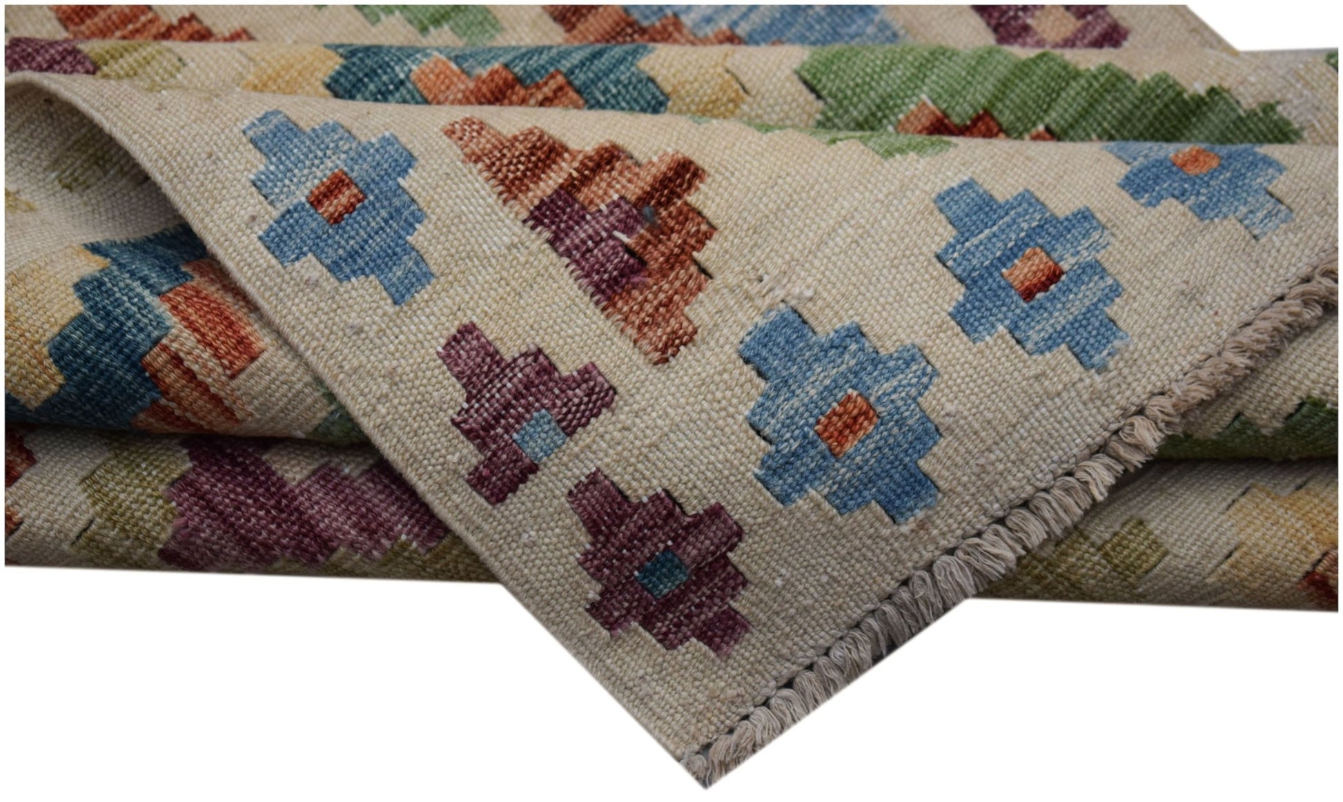 A handwoven Afghan Maimana kilim runner featuring a geometric pattern in colorful wool.