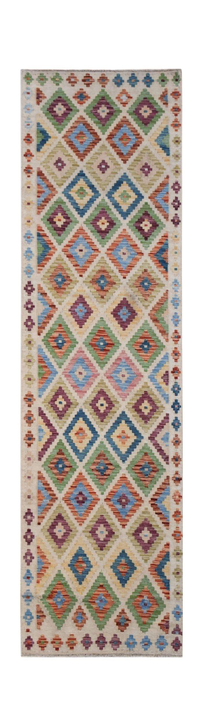 Handwoven Afghan Maimana wool runner rug featuring a colorful geometric diamond pattern.