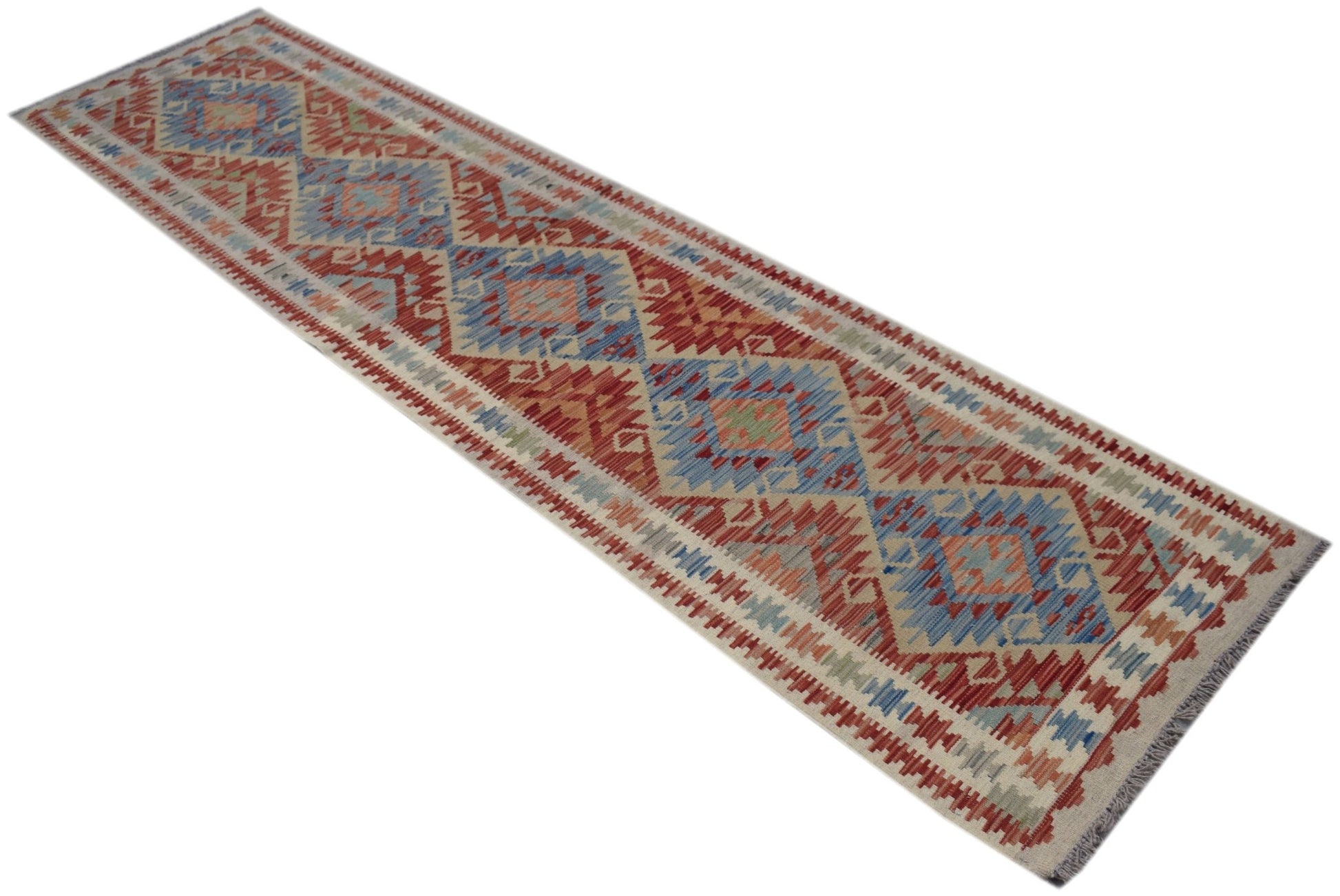 A handmade Afghan Maimana wool runner rug featuring a geometric diamond pattern in red and blue.