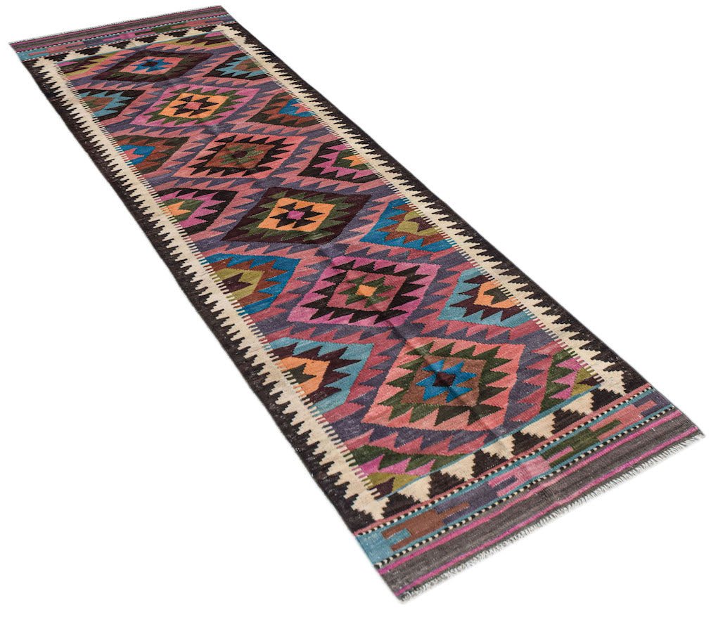 Handwoven Afghan Maimana wool runner rug featuring a colorful geometric diamond pattern.