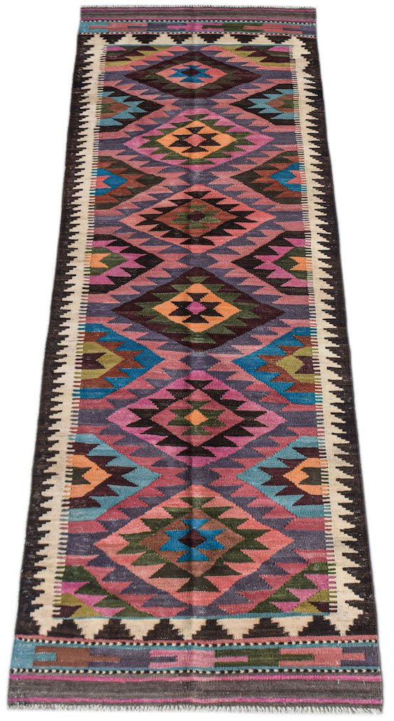 Handwoven Afghan Maimana wool runner featuring a colorful geometric diamond pattern.
