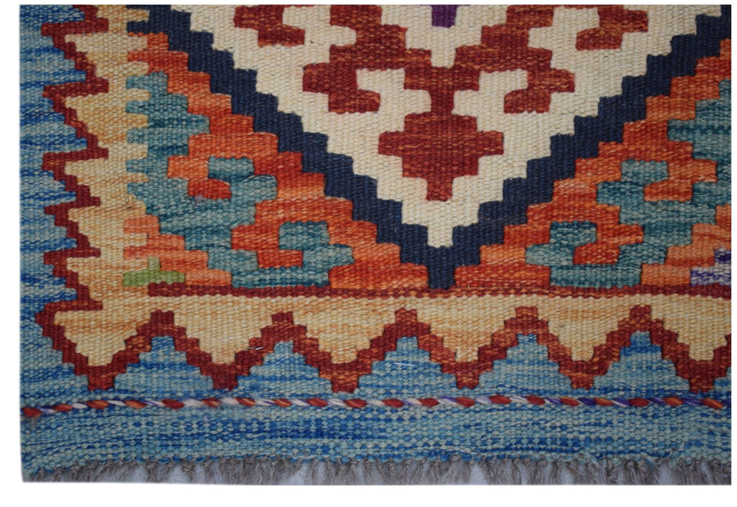 Handwoven Afghan Maimana wool runner featuring a geometric pattern in vibrant multi-colored tones.