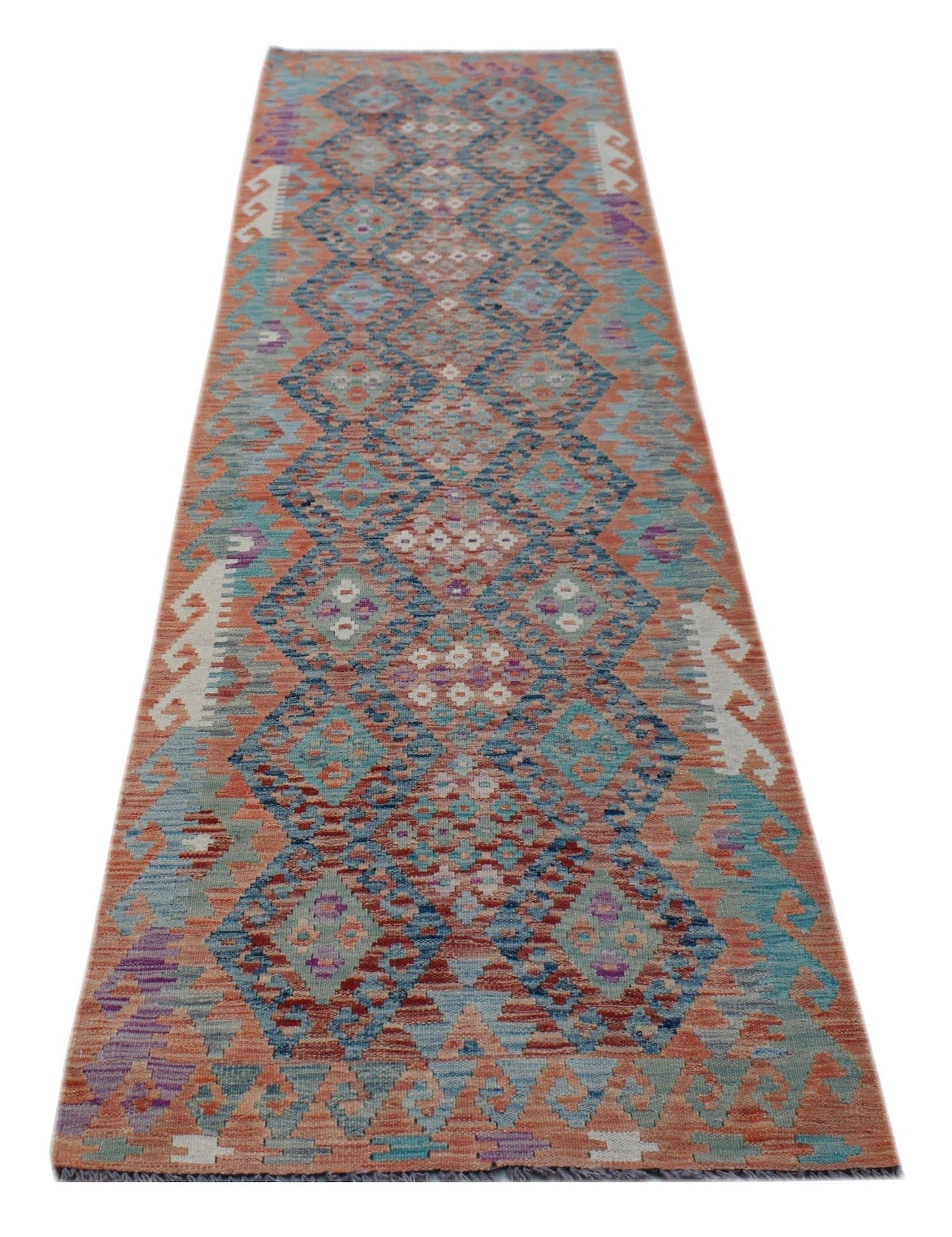 Handwoven Afghan Maimana wool runner rug featuring a geometric diamond pattern in vibrant colors.