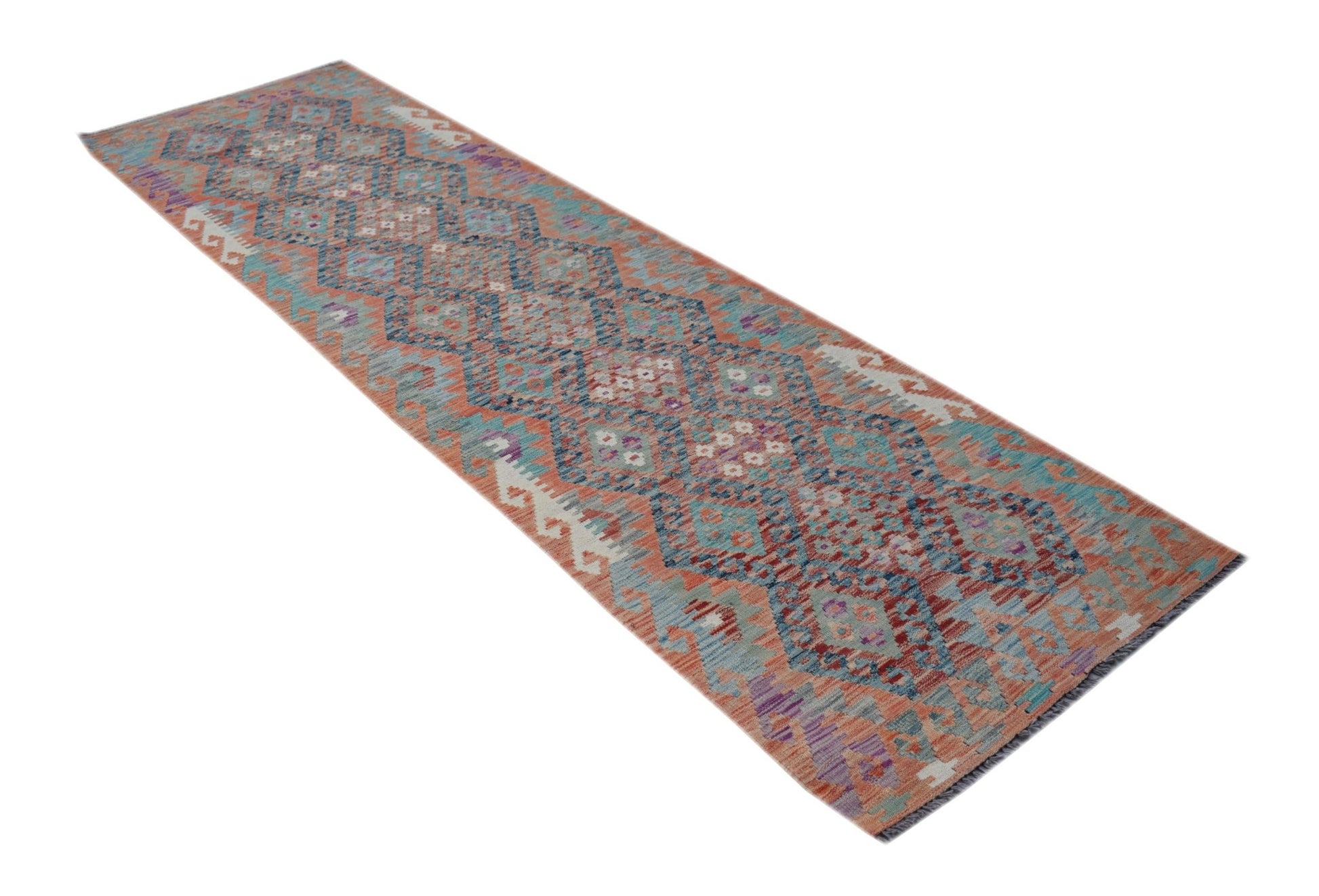 A handmade Afghan Maimana kilim runner featuring a geometric pattern in shades of blue and orange.