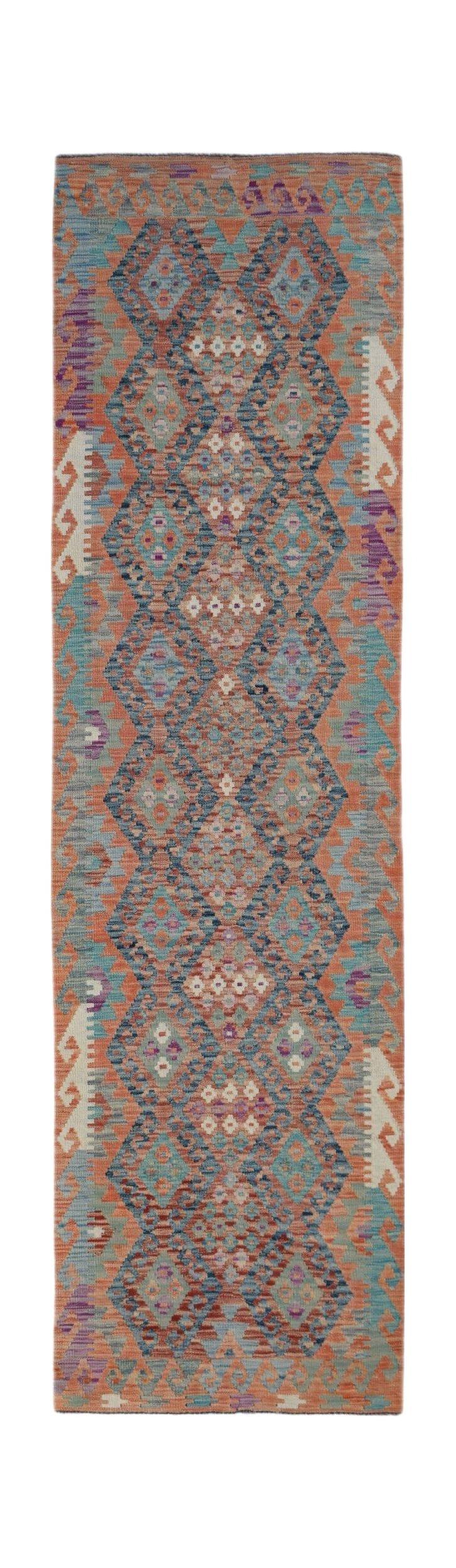 Handwoven Afghan Maimana wool runner featuring a geometric diamond pattern in orange and blue.